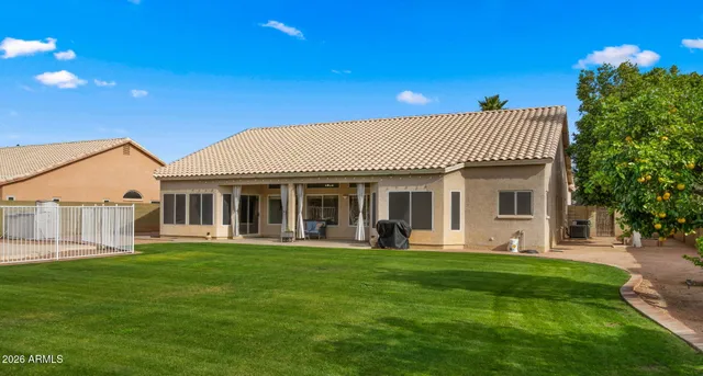 a view of a house with a tree