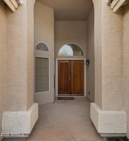 a building outdoor space with patio furniture and garden