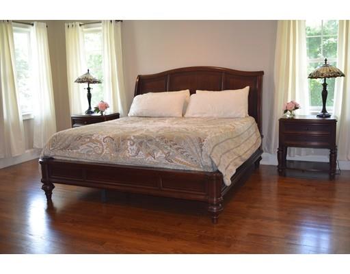 35 McCarthy Road Newton, MA 02459 - Photo 4 of 10 a bedroom with a bed and a night stand