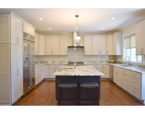 35 McCarthy Road Newton, MA 02459 - Photo 5 of 10 a kitchen with kitchen island granite countertop a sink cabinets and stainless steel appliances