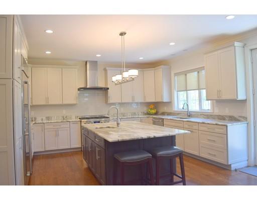 35 McCarthy Road Newton, MA 02459 - Photo 6 of 10 a kitchen with a sink stove and cabinets