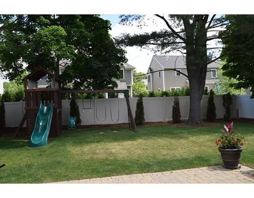 35 McCarthy Road Newton, MA 02459 - Photo 10 of 10 a view of a backyard with potted plants and large trees