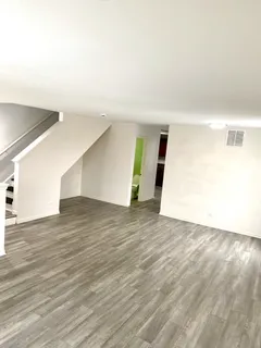 a kitchen with stainless steel appliances granite countertop a refrigerator a sink and a stove