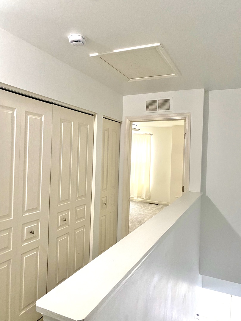 308 Niagara Drive Volo, IL 60073 - Photo 9 of 17 a view of a hallway with wooden floor and cabinet