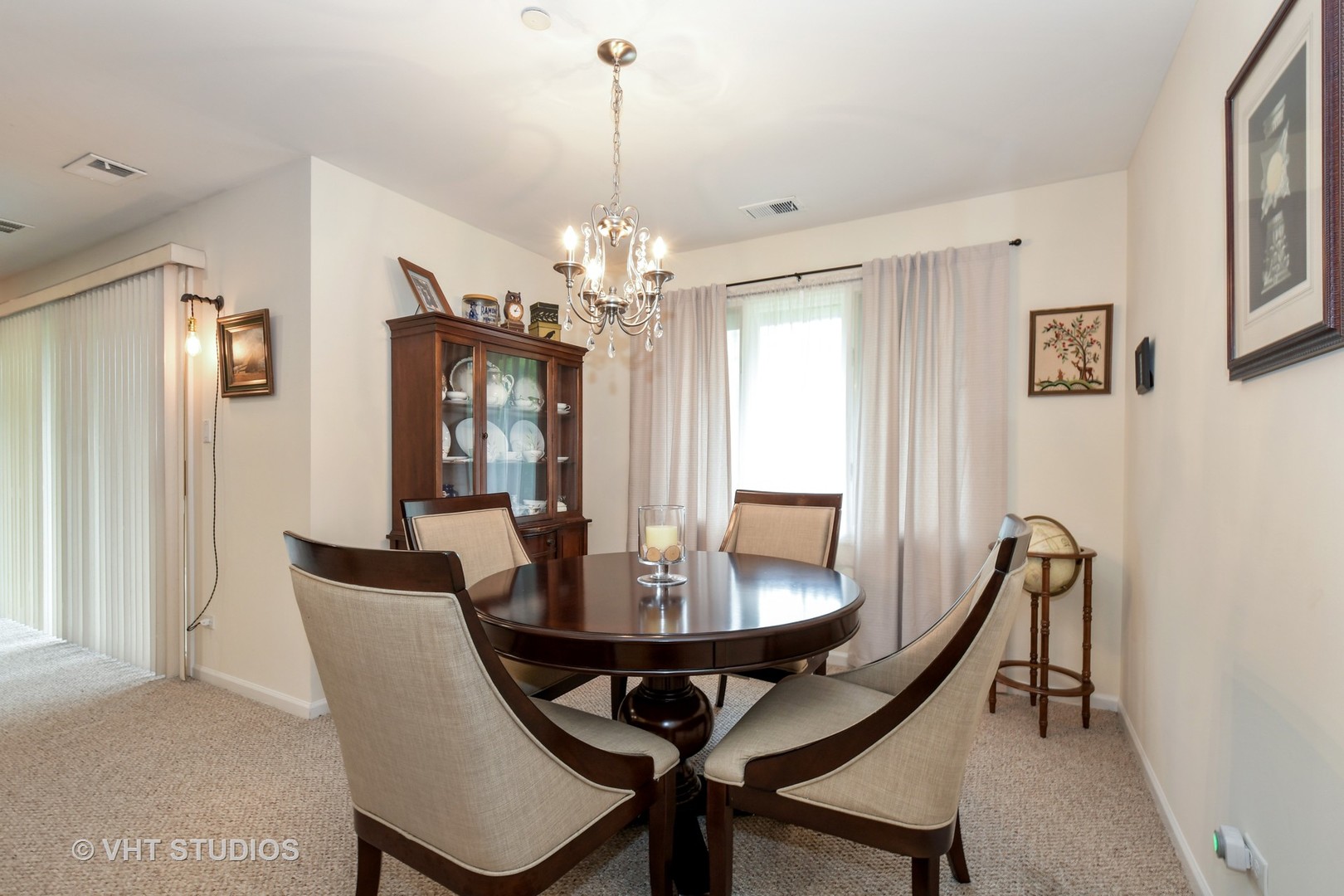 1979 Ammer Ridge Court, Unit 301 Glenview, IL 60025 - Photo 5 of 12 a view of a dining room with furniture and chandelier