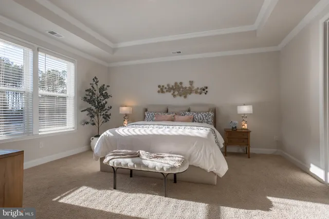 a spacious bathroom with a granite countertop sink mirror and toilet