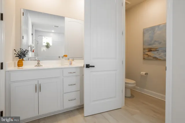 a bedroom with two beds and a lamp