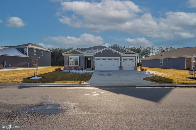 a view of a house with swimming pool and a yard