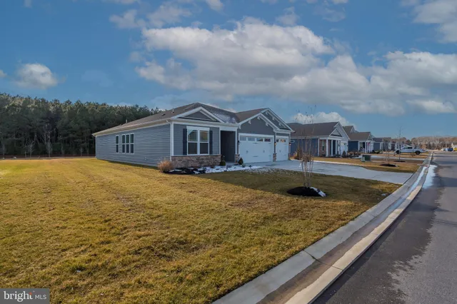an aerial view of a house with a ocean view