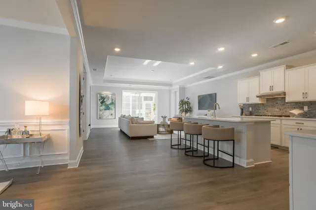 a kitchen with refrigerator and cabinets