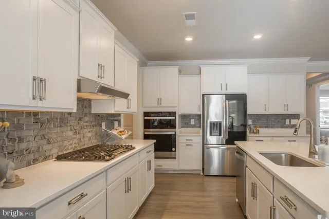 a kitchen with a stove and cabinets