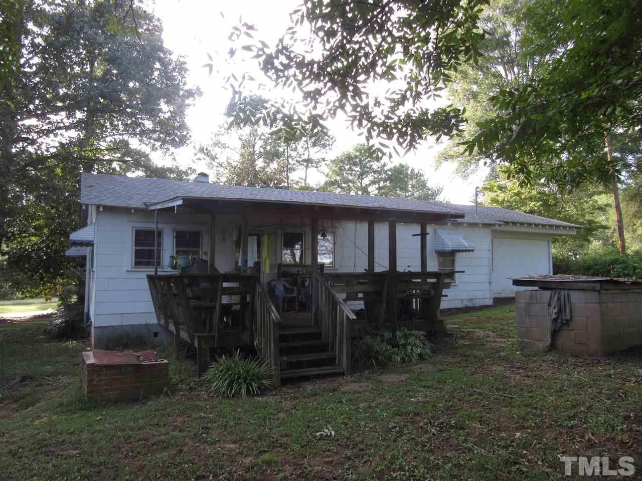 2281 Bryantown Road, Unit 68 49 ACRES Spring Hope, NC 27882 - Photo 13 of 21 a front view of house with yard barbeque oven and barbeque oven