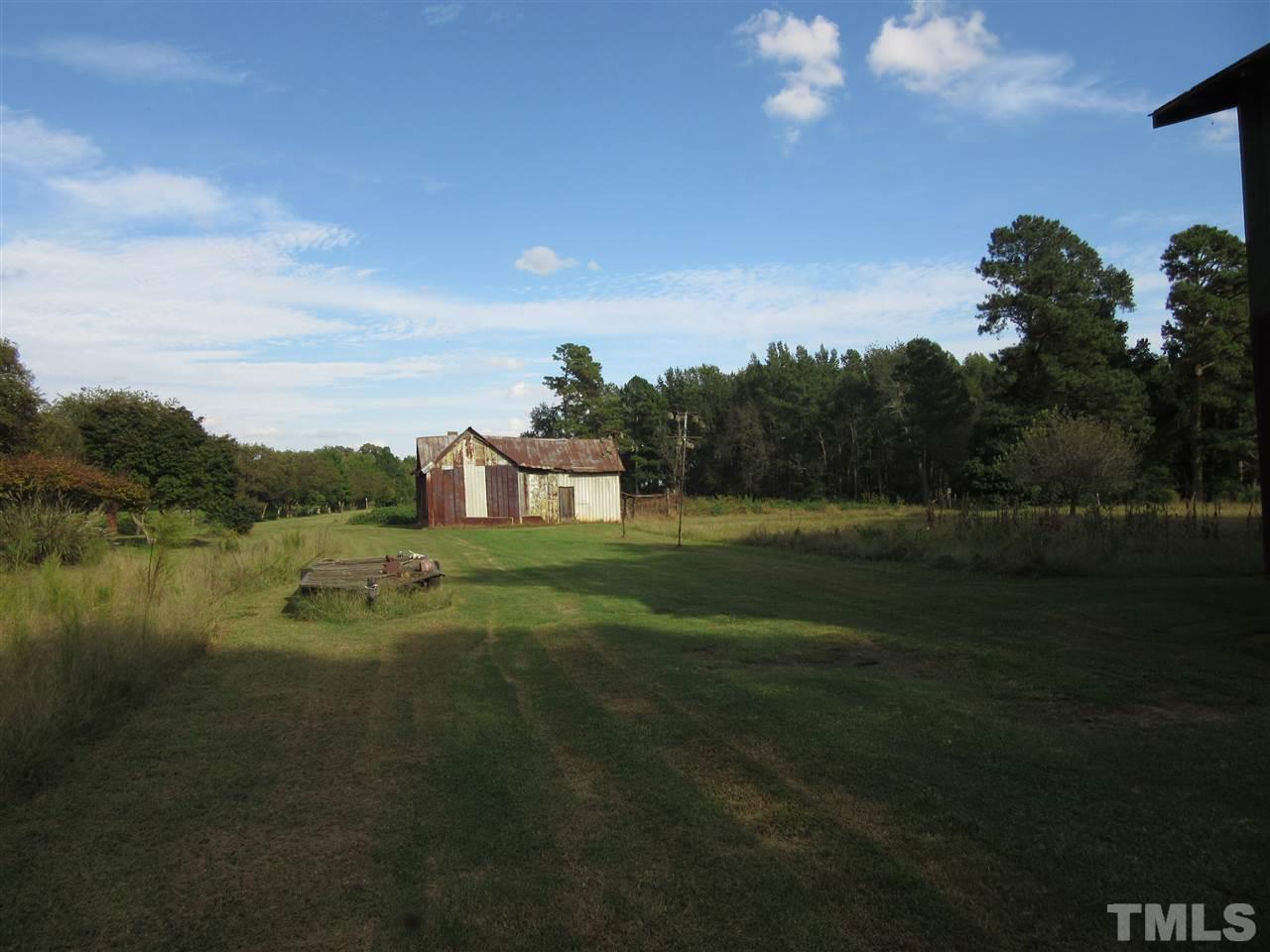 2281 Bryantown Road, Unit 68 49 ACRES Spring Hope, NC 27882 - Photo 16 of 21 a view of a lake with a big yard