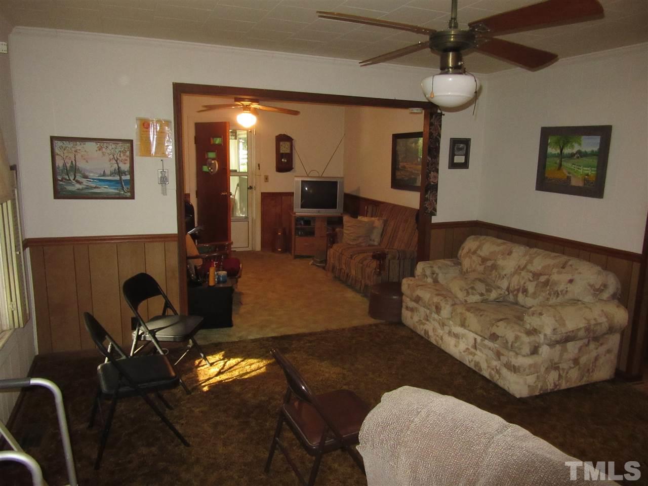 2281 Bryantown Road, Unit 68 49 ACRES Spring Hope, NC 27882 - Photo 18 of 21 a living room with furniture and a flat screen tv
