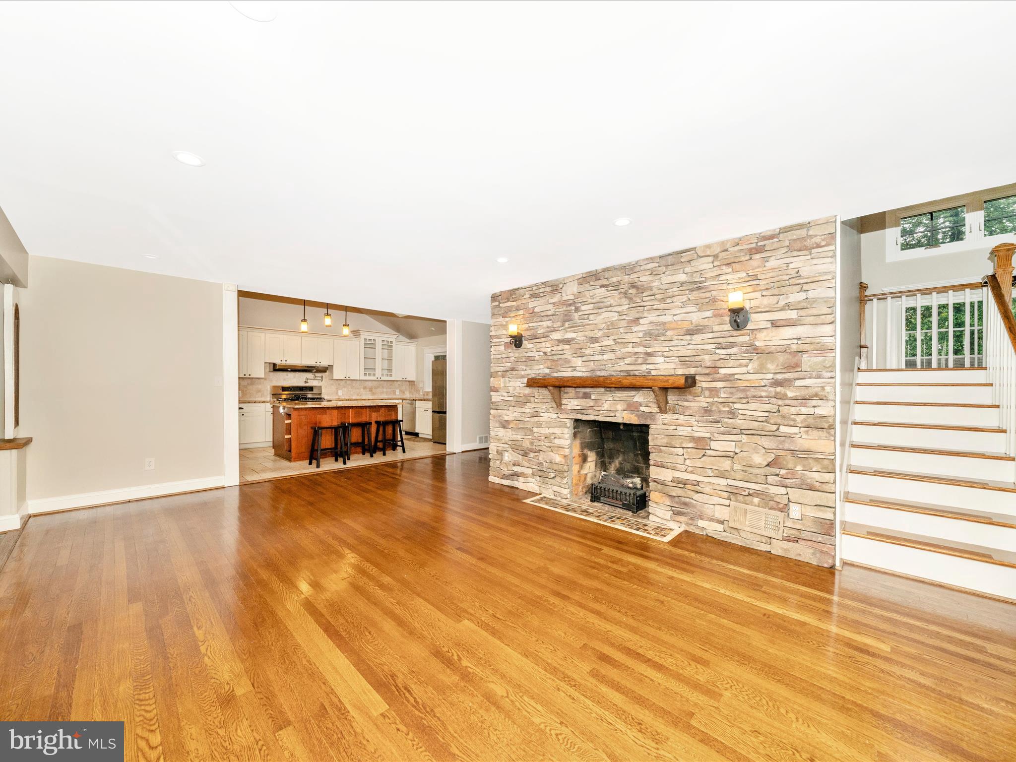 1925 Pagebrook Road Silver Spring, MD 20903 - Photo 14 of 74 a view of a livingroom with wooden floor and a fireplace