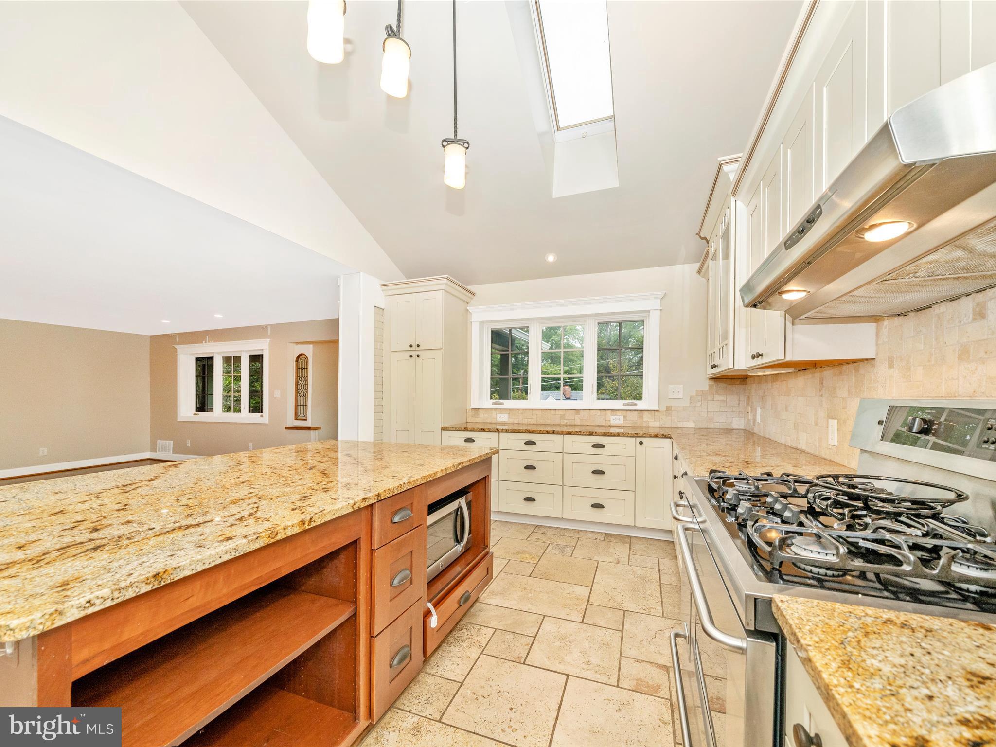 1925 Pagebrook Road Silver Spring, MD 20903 - Photo 21 of 74 a kitchen with stainless steel appliances granite countertop a stove and a sink