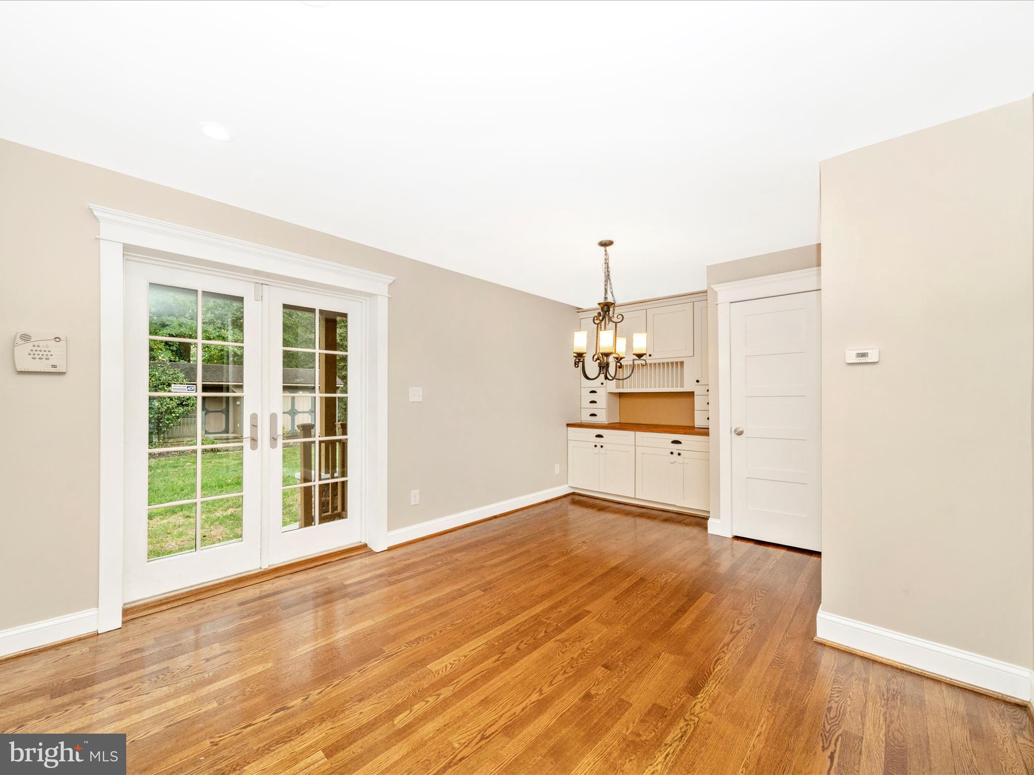 1925 Pagebrook Road Silver Spring, MD 20903 - Photo 22 of 74 an empty room with wooden floor and windows