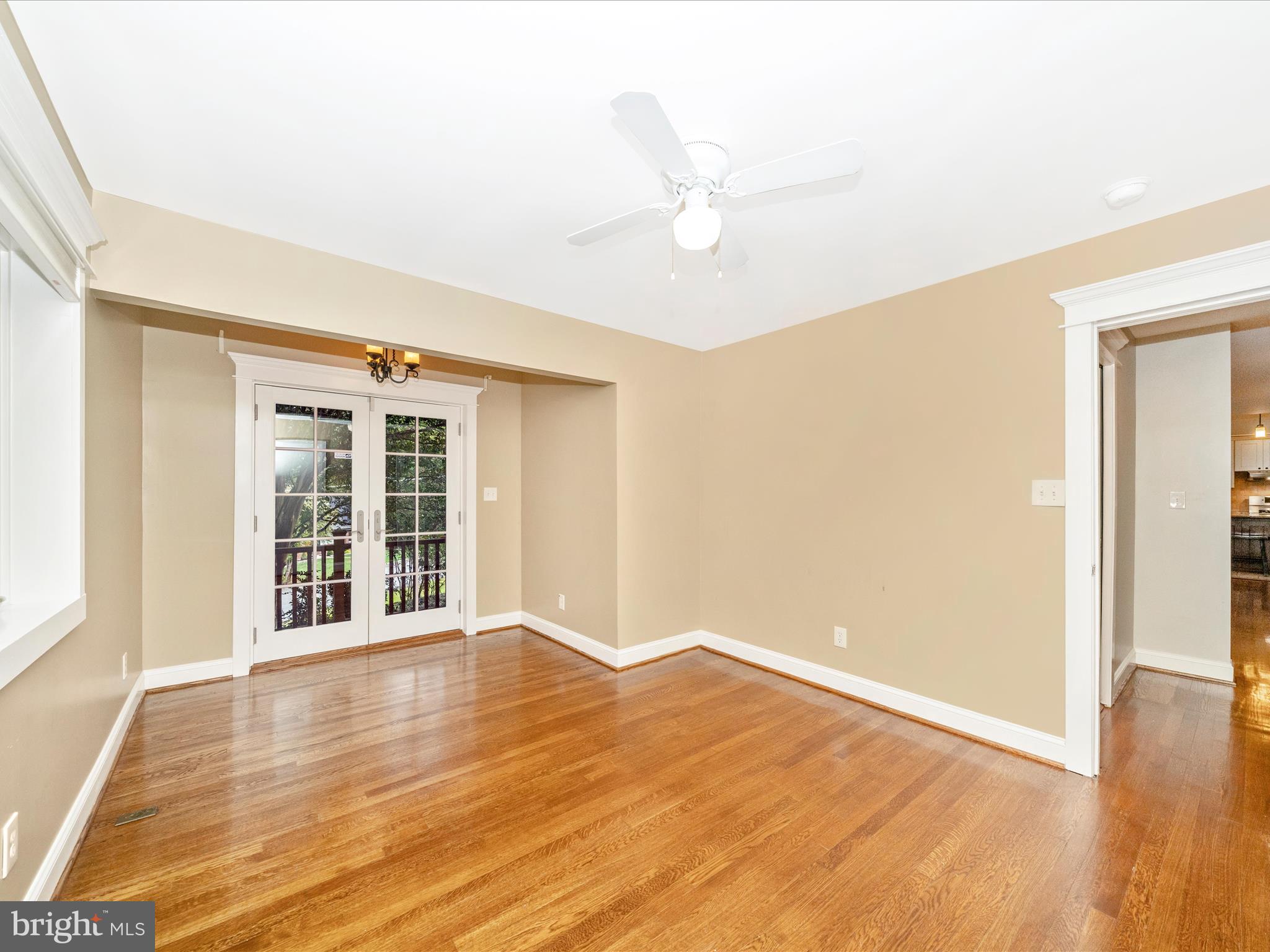 1925 Pagebrook Road Silver Spring, MD 20903 - Photo 25 of 74 an empty room with wooden floor and windows