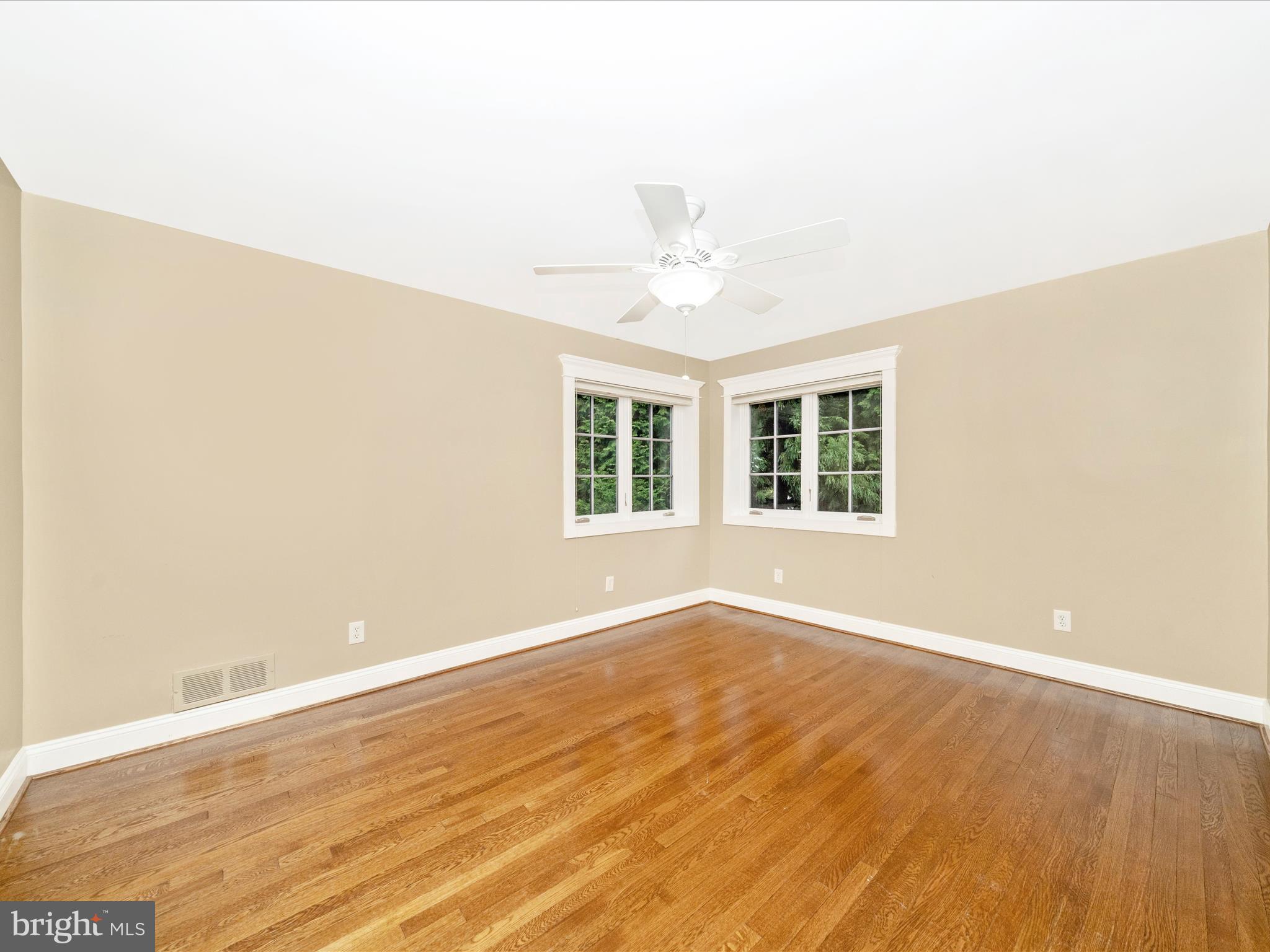 1925 Pagebrook Road Silver Spring, MD 20903 - Photo 27 of 74 an empty room with wooden floor and windows