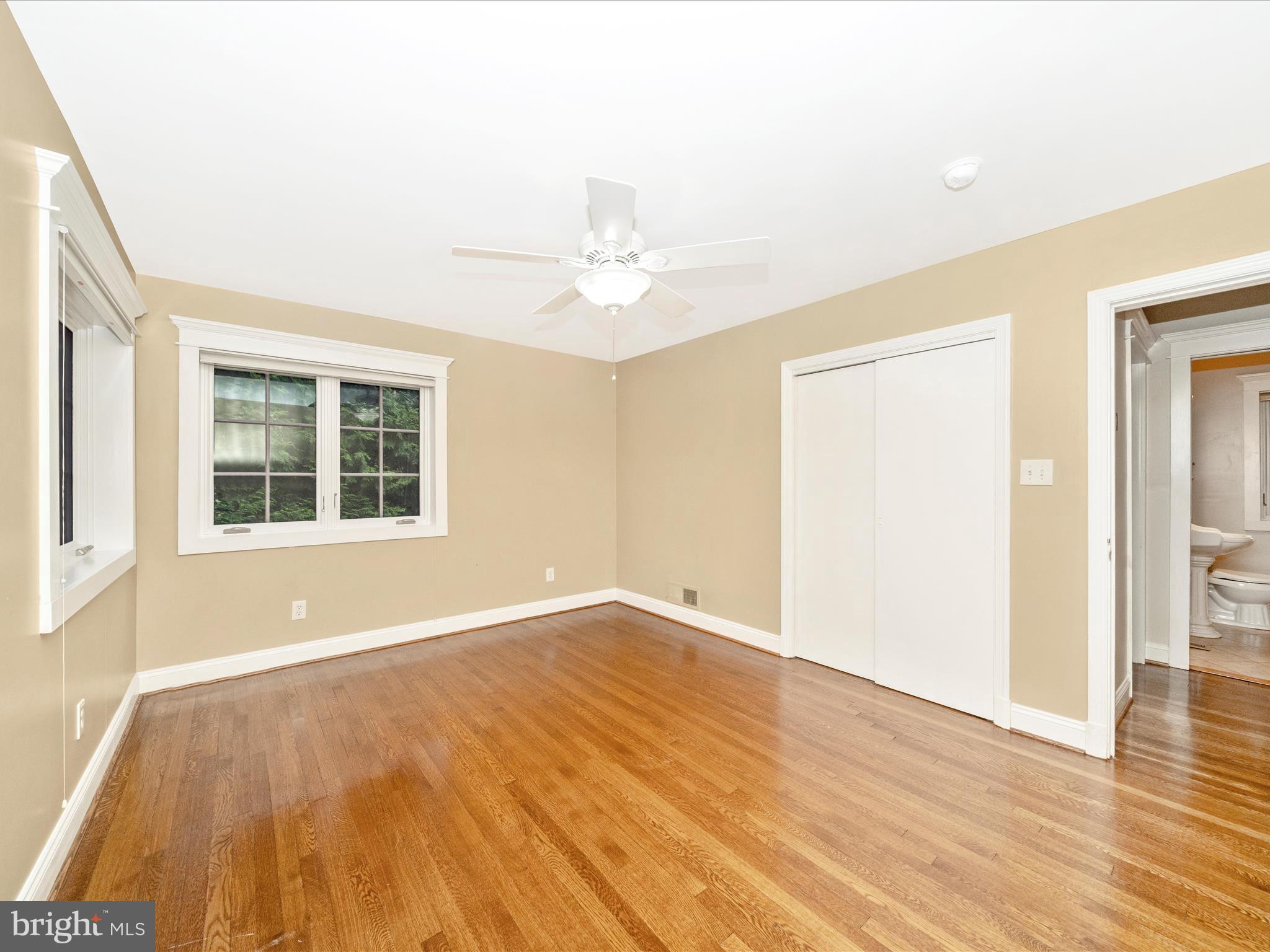 1925 Pagebrook Road Silver Spring, MD 20903 - Photo 28 of 74 a view of an empty room with wooden floor and a window