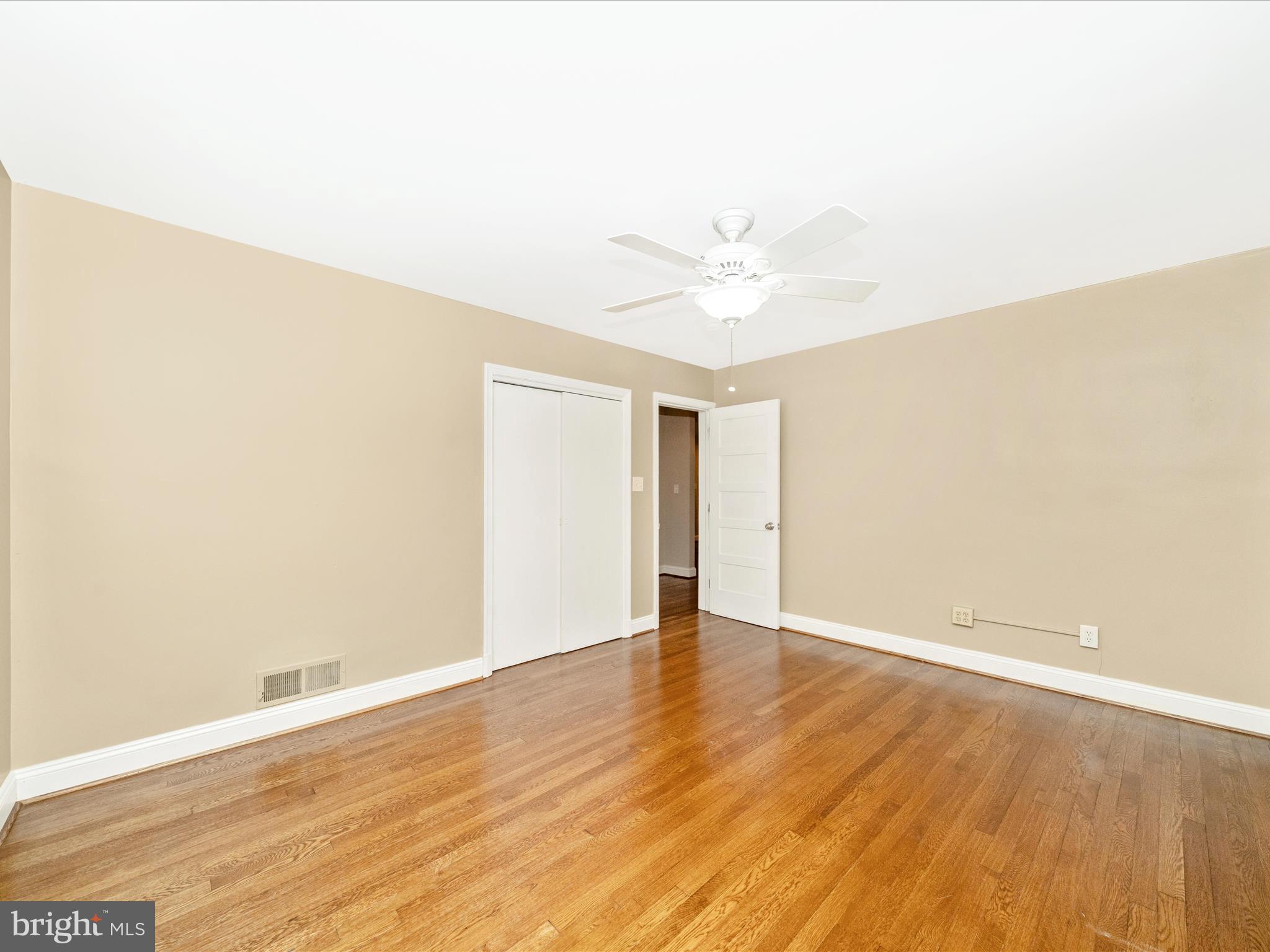 1925 Pagebrook Road Silver Spring, MD 20903 - Photo 29 of 74 a view of an empty room with wooden floor
