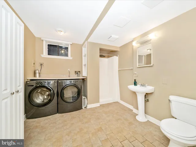 a view of a porch with a floor to ceiling window next to a yard