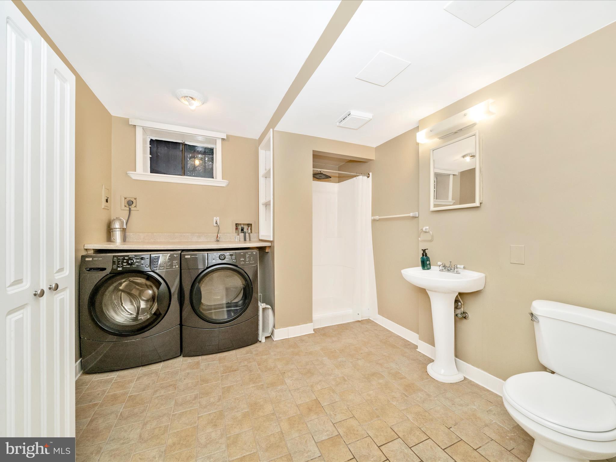 1925 Pagebrook Road Silver Spring, MD 20903 - Photo 47 of 74 a bathroom with a toilet a sink and a mirror
