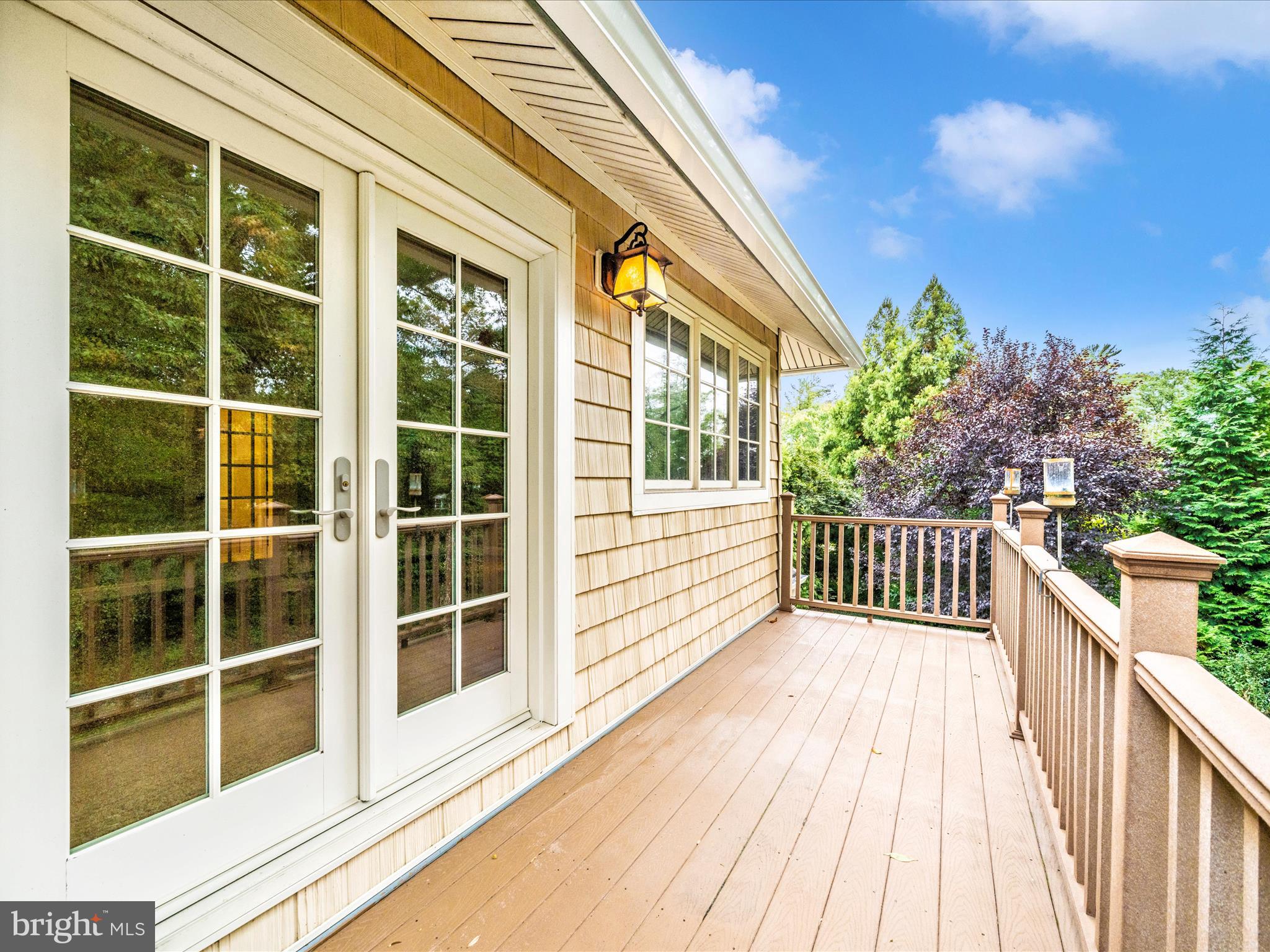 1925 Pagebrook Road Silver Spring, MD 20903 - Photo 49 of 74 a view of a balcony with a large window and wooden fence