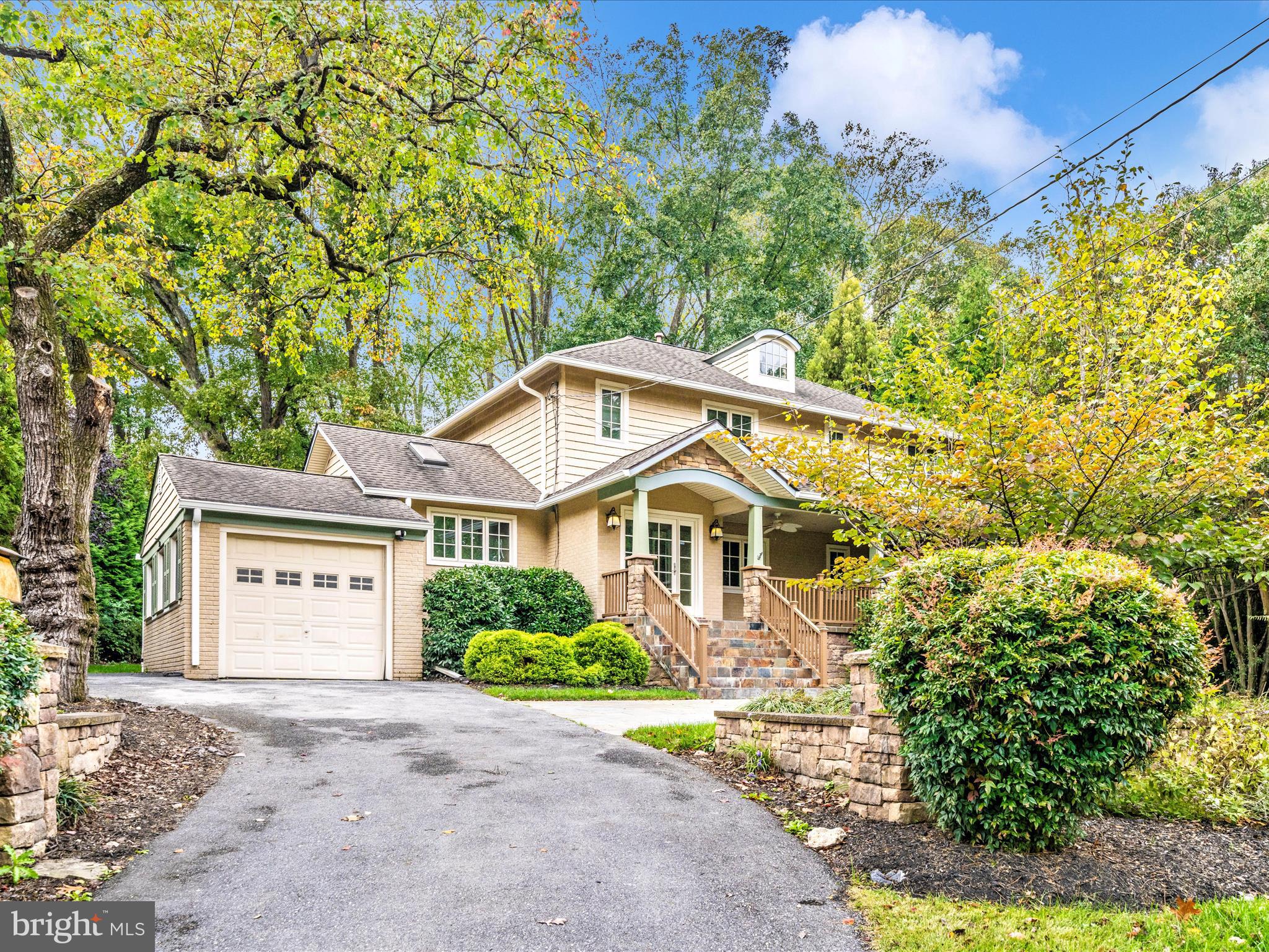 1925 Pagebrook Road Silver Spring, MD 20903 - Photo 60 of 74 a front view of a house with a garden and yard