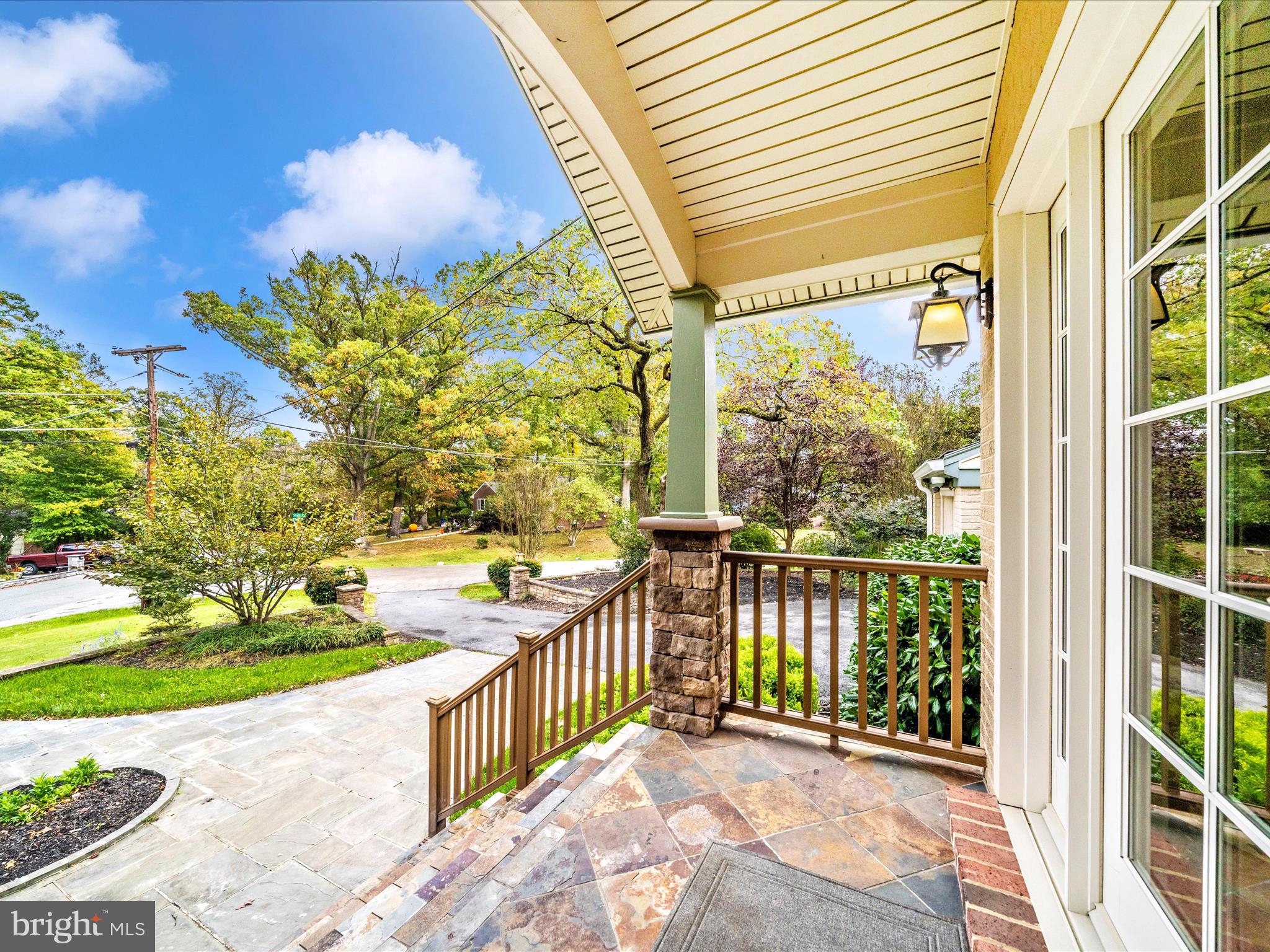 1925 Pagebrook Road Silver Spring, MD 20903 - Photo 66 of 74 a view of a porch with a floor to ceiling window next to a yard