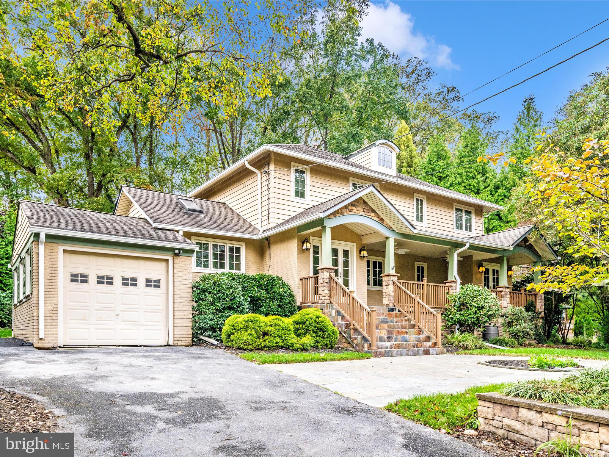 1925 Pagebrook Road Silver Spring, MD 20903 - Photo 8 of 74 a front view of a house with a garden and plants