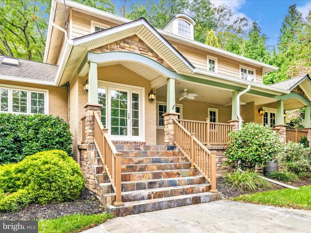 a front view of a house with a porch