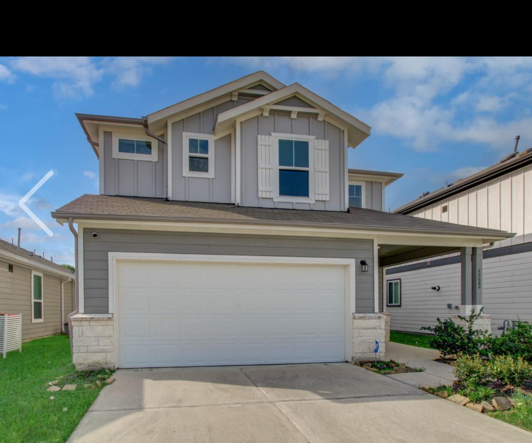 a front view of a house with a garage