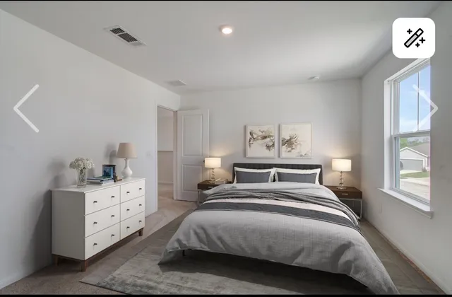 a bedroom with a bed and a cabinets