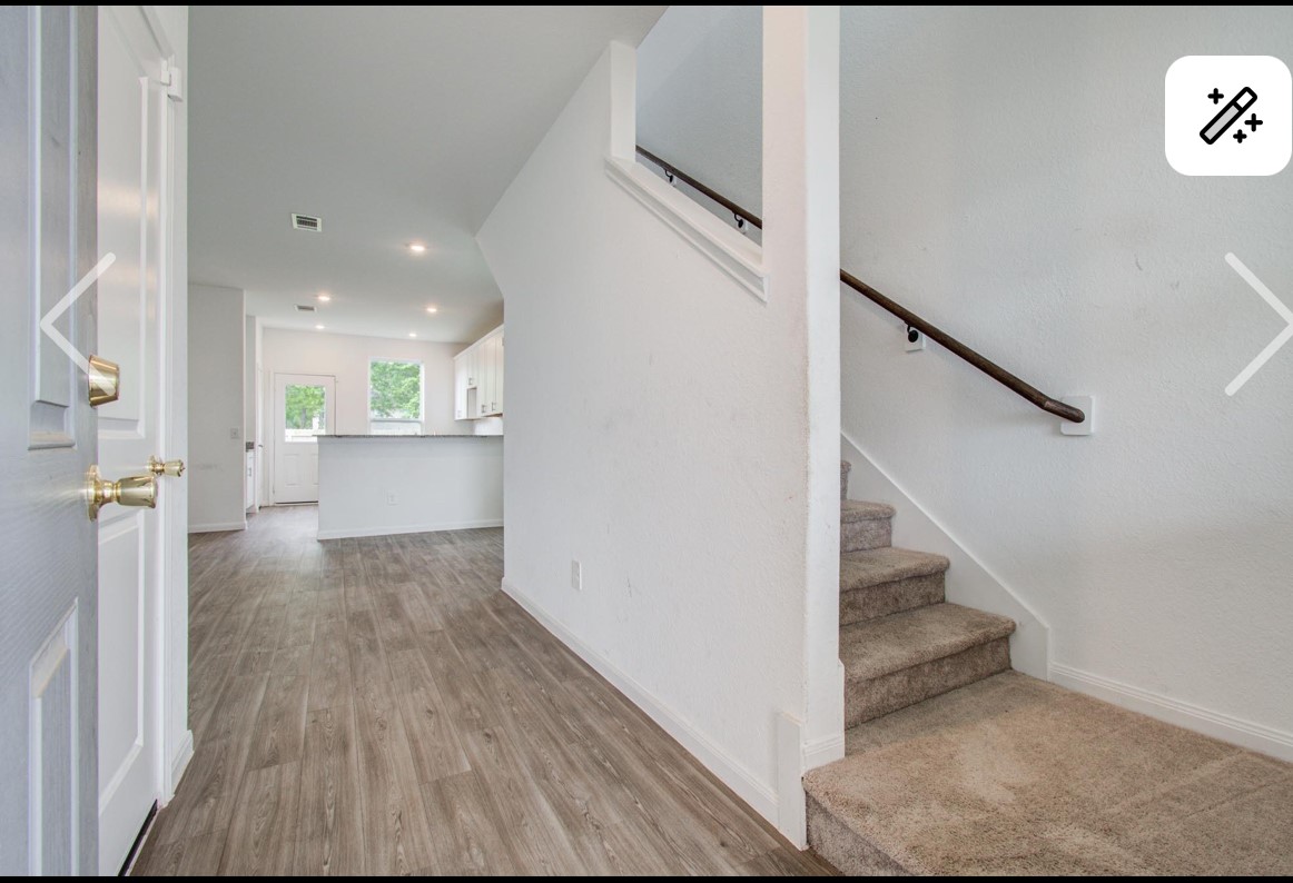 5522 Broad Spruce Street Spring, TX 77373 - Photo 2 of 21 a view of a hallway with wooden floor and staircase