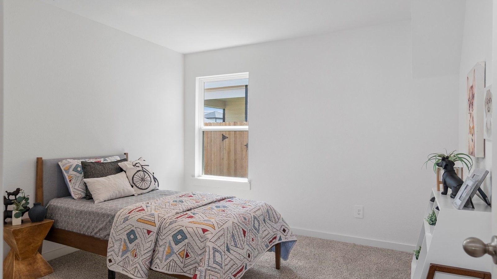 6203 Brookhaven Street Rosenberg, TX 77469 - Photo 19 of 38 a bedroom with a bed and a potted plant