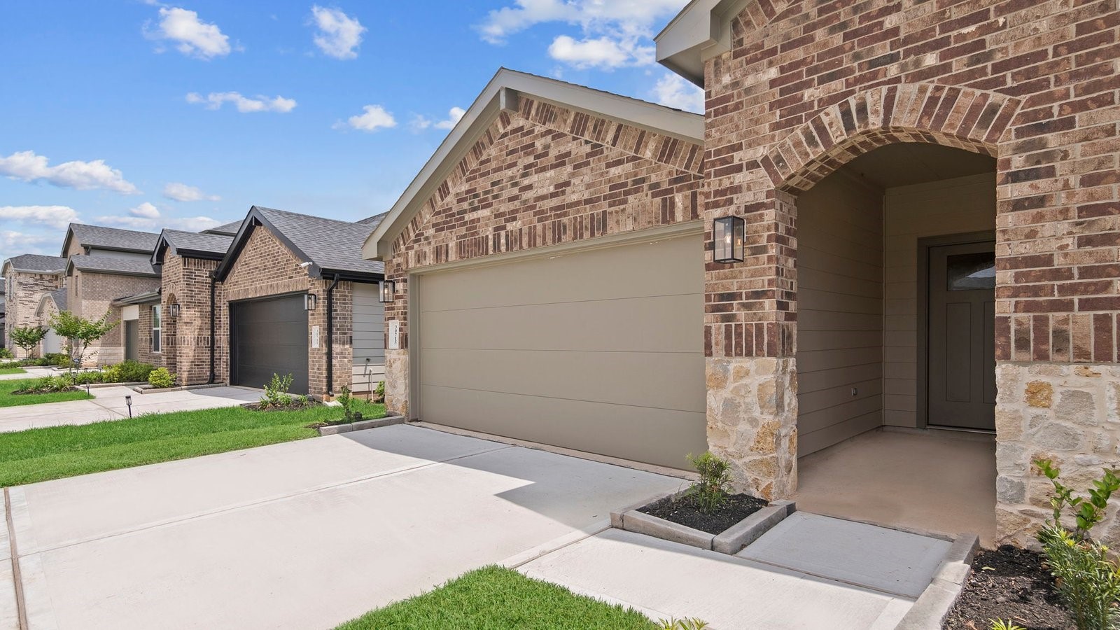 6203 Brookhaven Street Rosenberg, TX 77469 - Photo 2 of 38 a front view of a house with a yard and garage