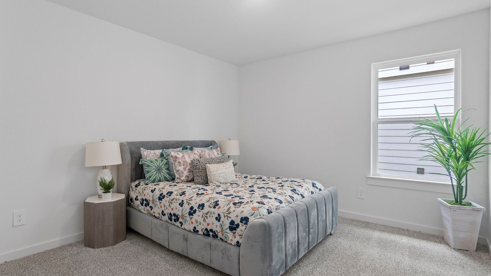 6203 Brookhaven Street Rosenberg, TX 77469 - Photo 7 of 38 a bedroom with a large bed and a potted plant