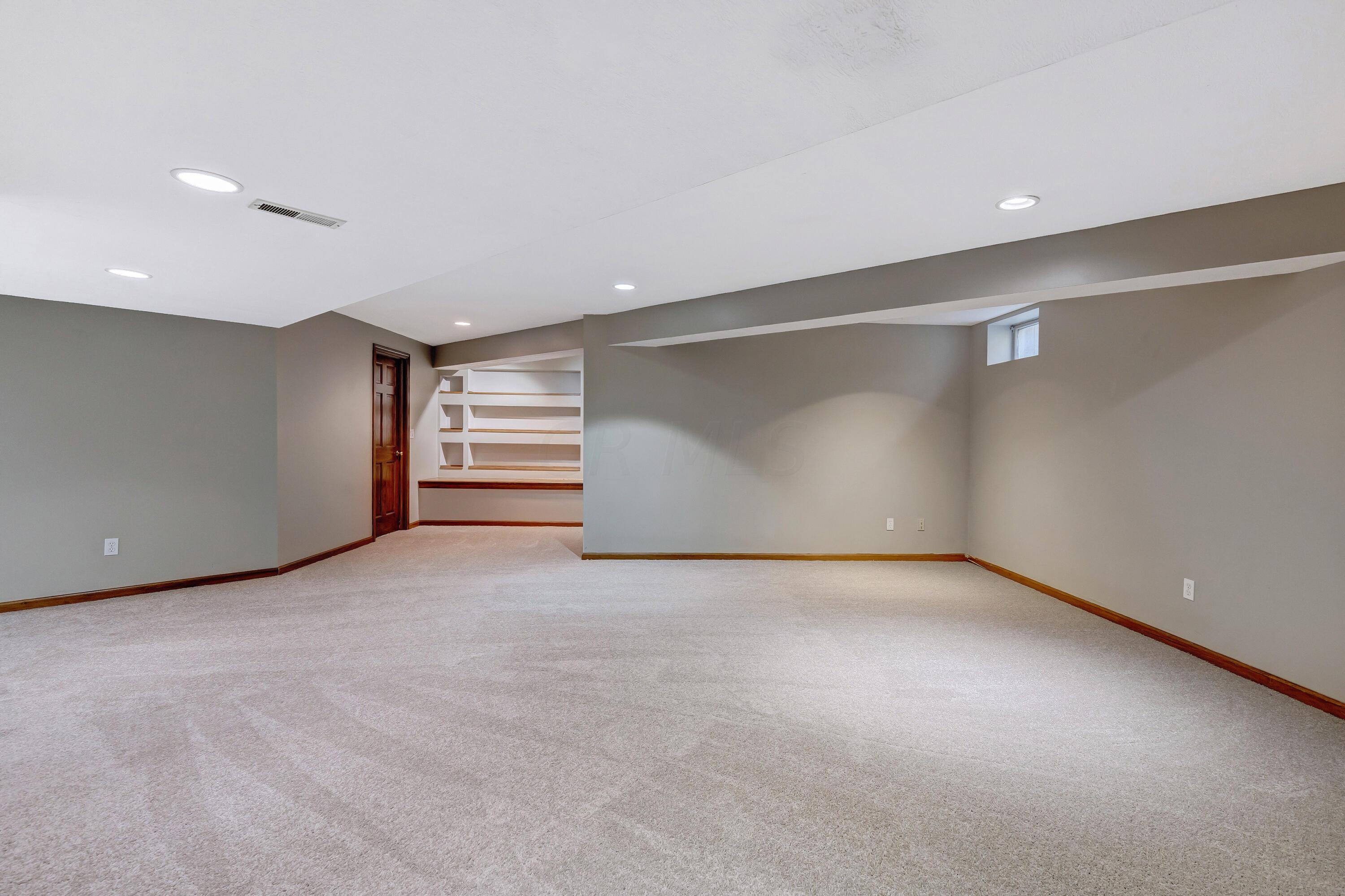10640 Center Village Road Galena, OH 43021 - Photo 48 of 80 • New grey carpet ~ 2022 • Light grey painted walls • Can lighting • Walk-in closet with single door • Bench seat with storage