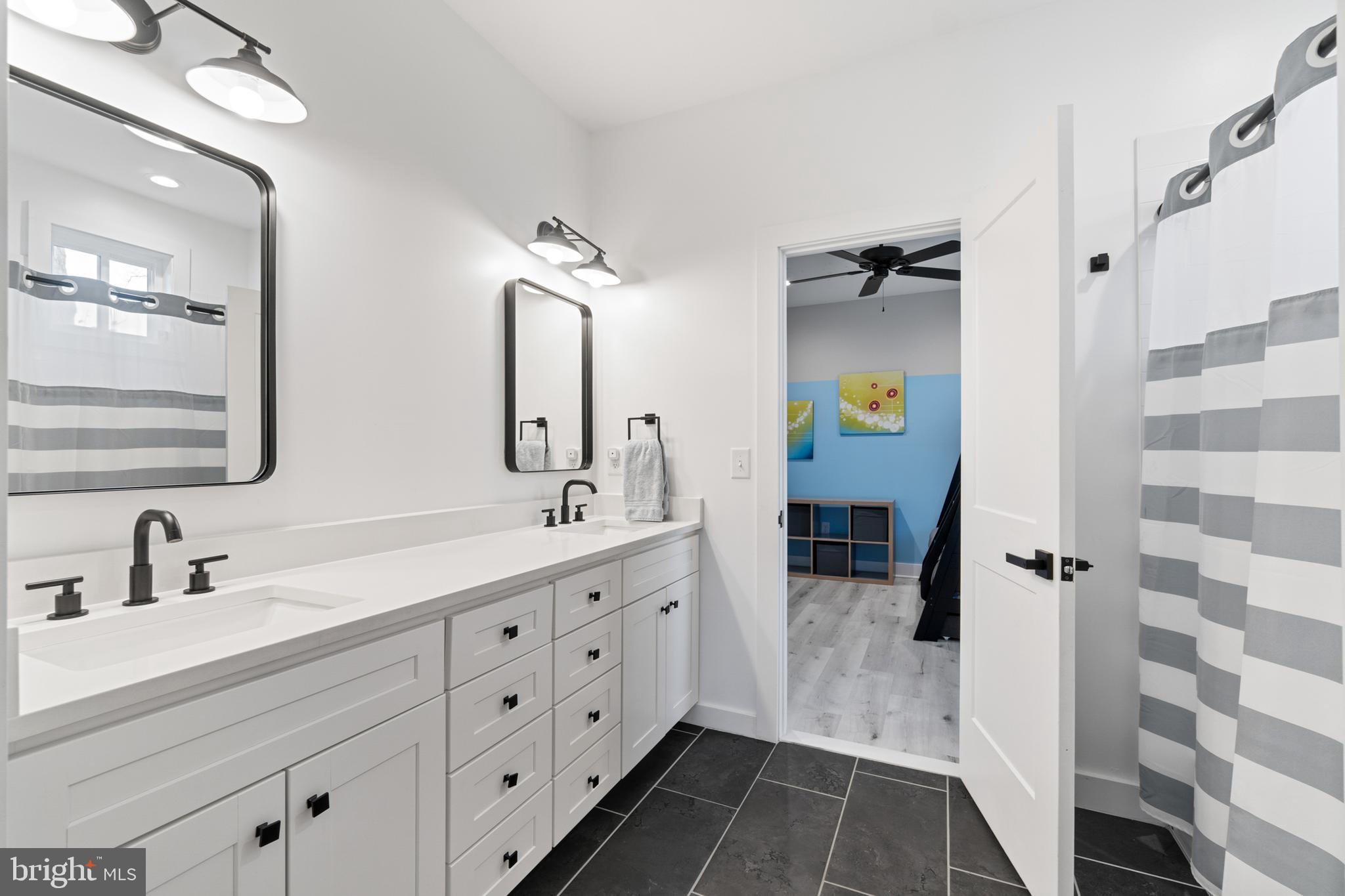 338 Somerset Road Pasadena, MD 21122 - Photo 39 of 70 Connecting ensuite shared bathroom with shower/tub