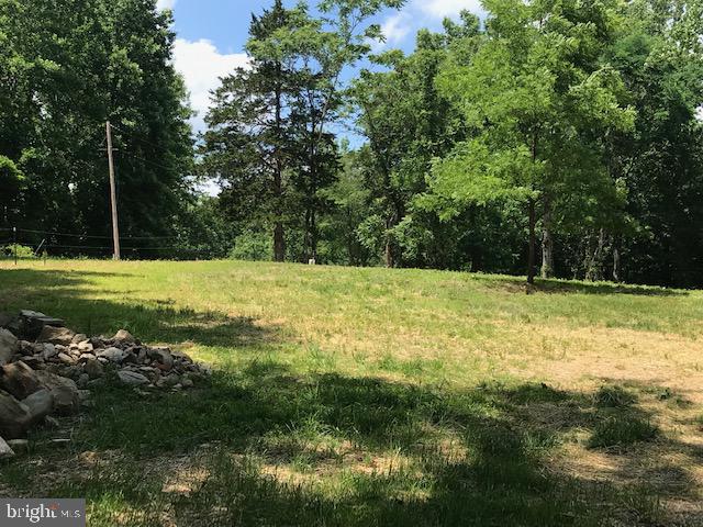 Building site nestled around mature trees