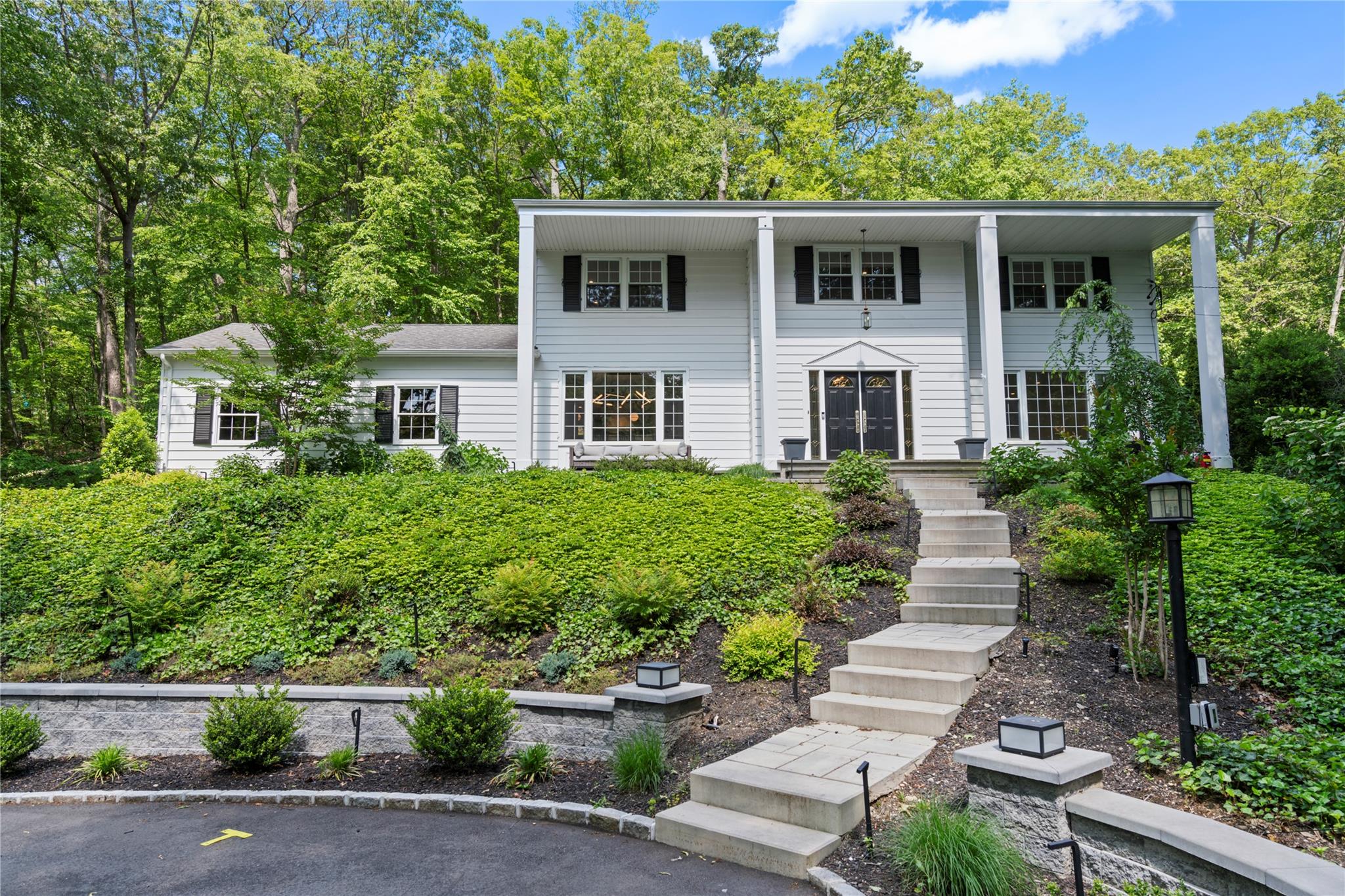 front view of a house with a yard