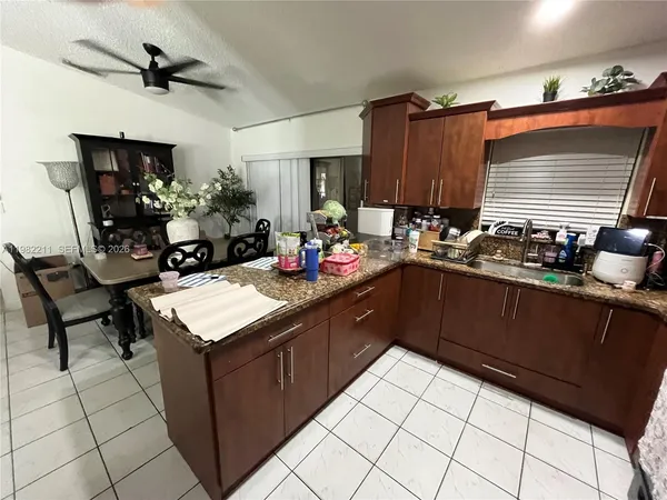 a kitchen with a sink and cabinets