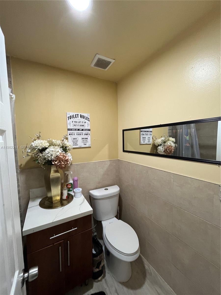 13485 Southwest 28th Street Miami, FL 33175 - Photo 16 of 33 a bathroom with a toilet