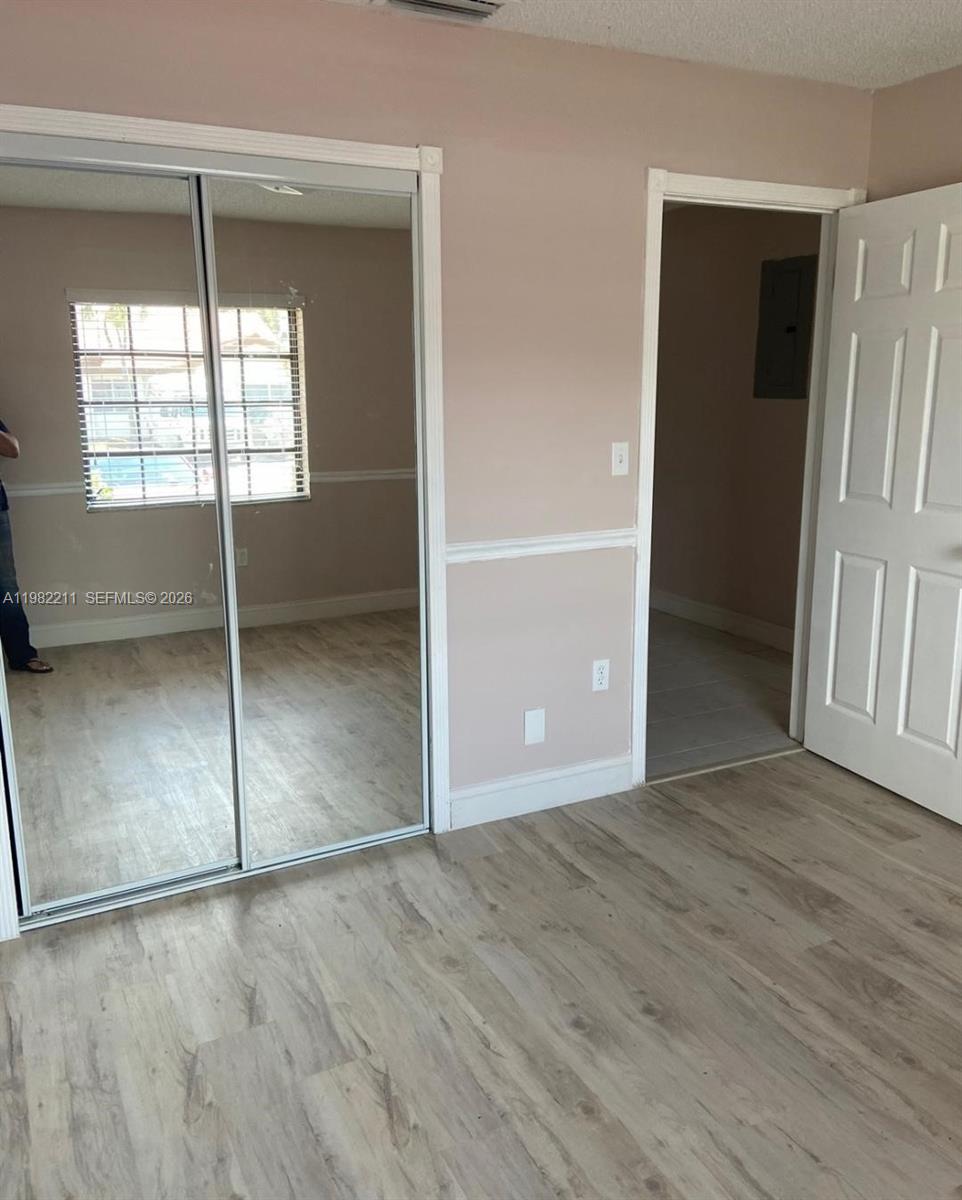 13485 Southwest 28th Street Miami, FL 33175 - Photo 17 of 33 an empty room with windows and closet