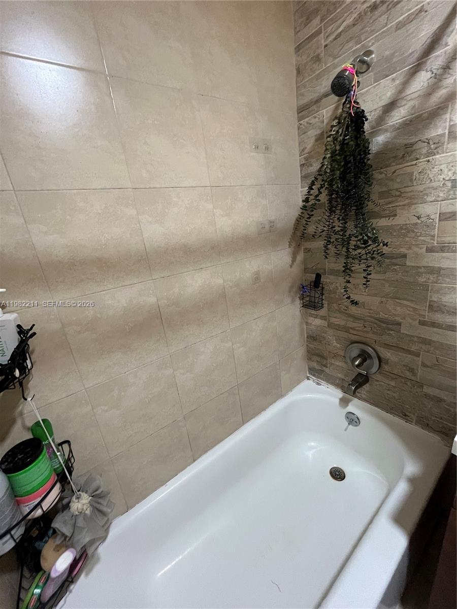 13485 Southwest 28th Street Miami, FL 33175 - Photo 18 of 33 a bathroom with a tub