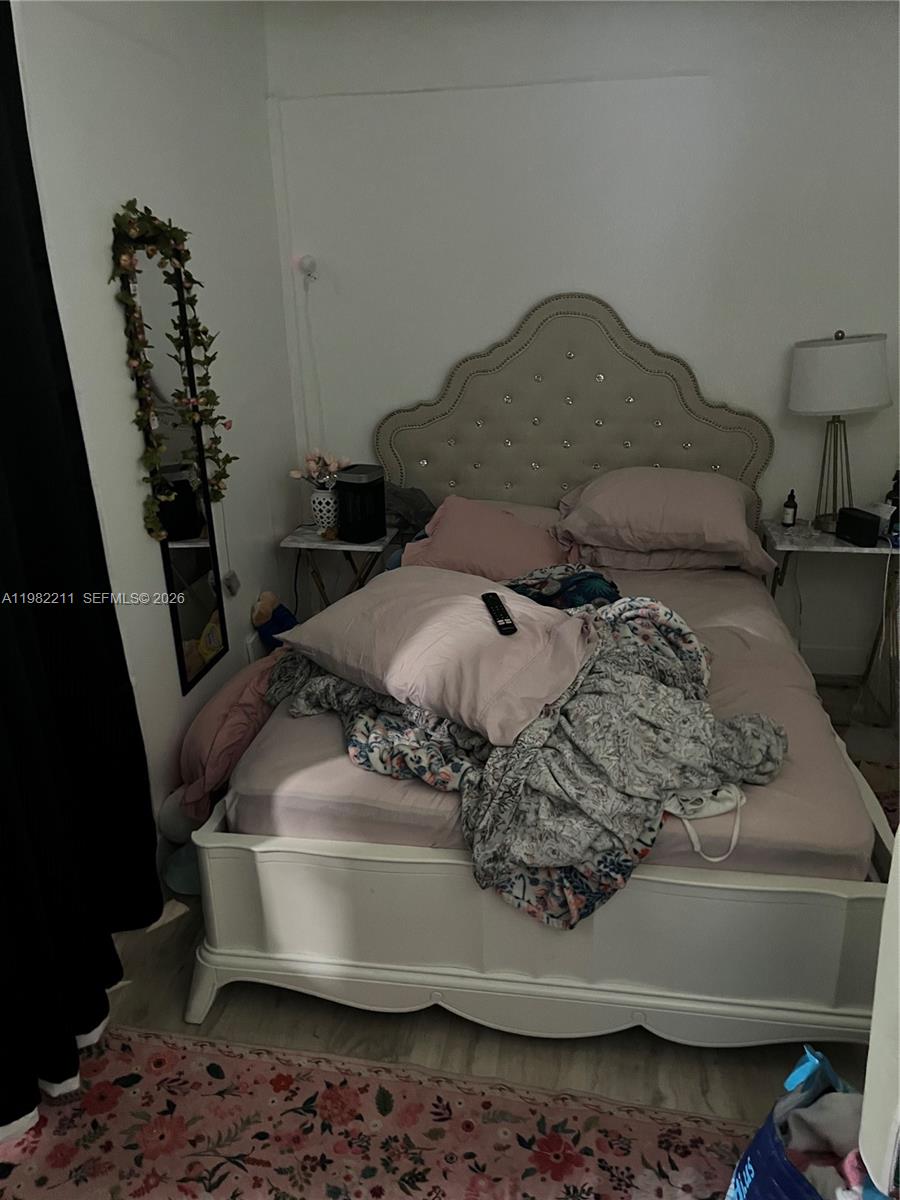 13485 Southwest 28th Street Miami, FL 33175 - Photo 25 of 33 a bed sitting in a bedroom next to a window