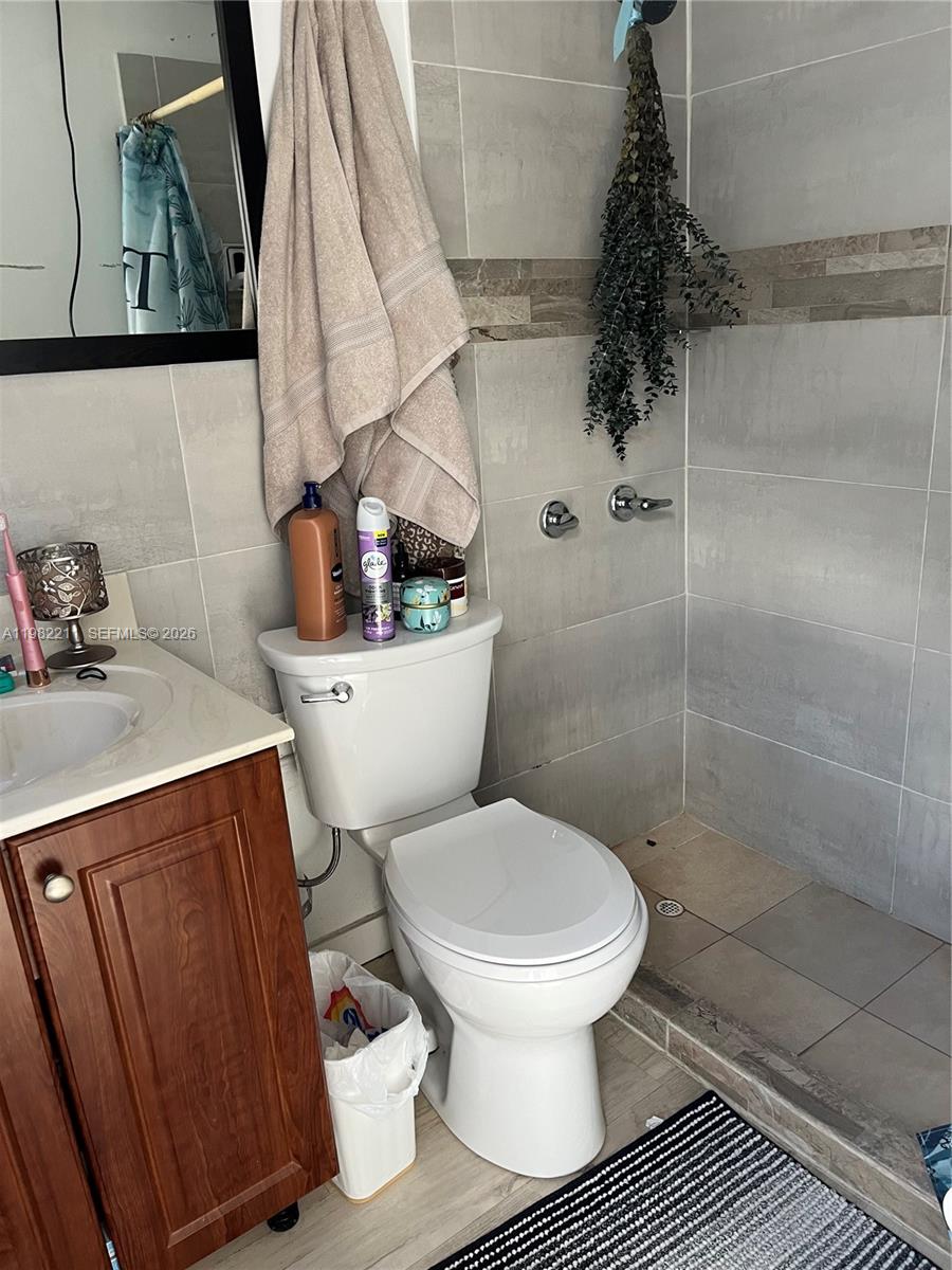 13485 Southwest 28th Street Miami, FL 33175 - Photo 26 of 33 a bathroom with a toilet and a shower