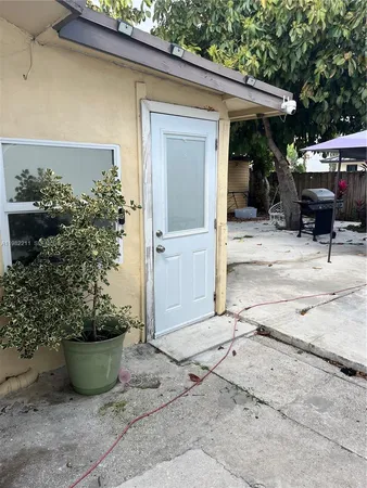 a view of a backyard of the house