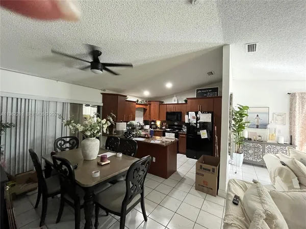 a view of a dining room and kitchen